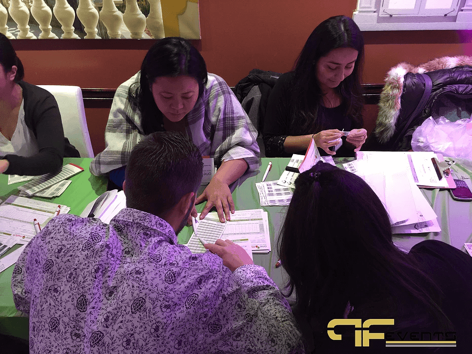 Volunteers helping registrants with OneMatch paperwork