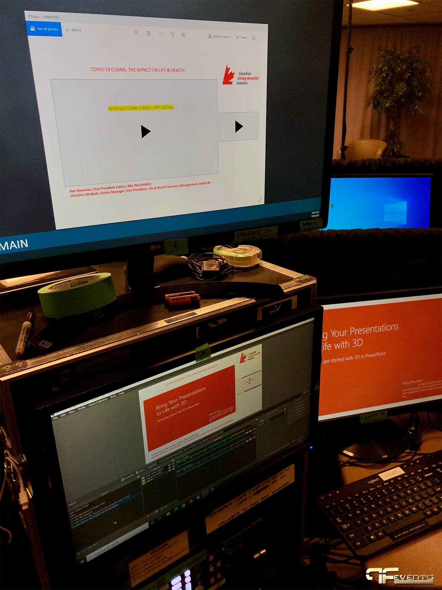Main encoder monitor showing a seminar slide above a rack of gear