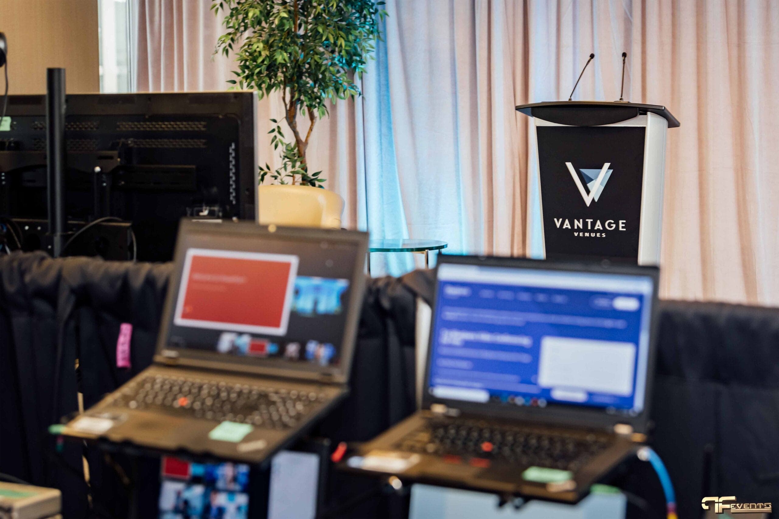 Vantage Venues podium with twin mics behind the laptop control area